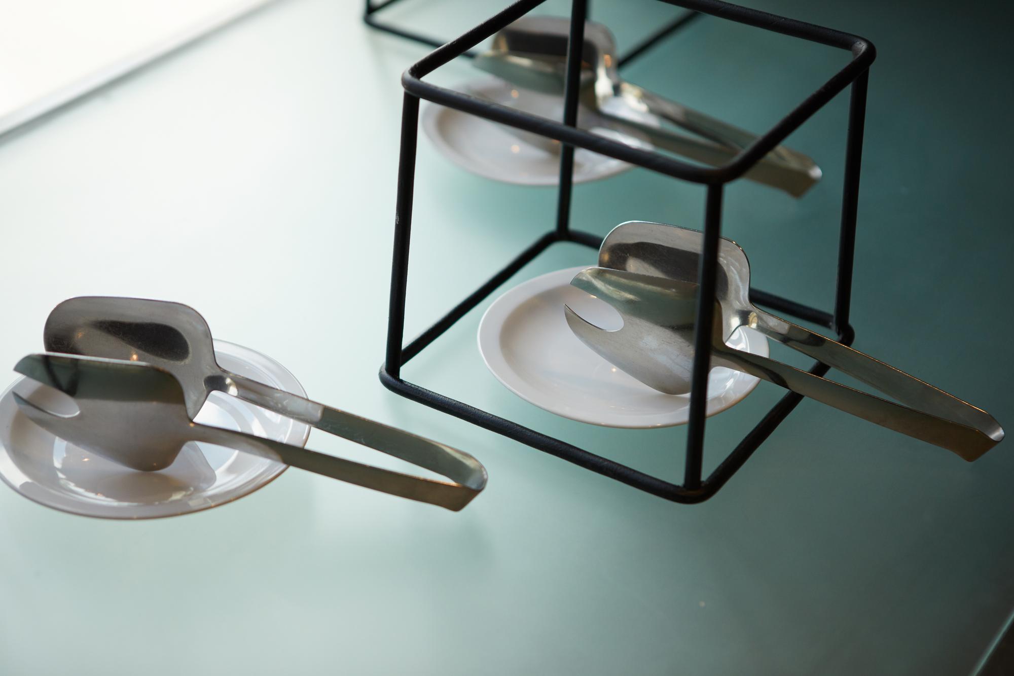 A tidy kitchen counter with plated dish and utensils